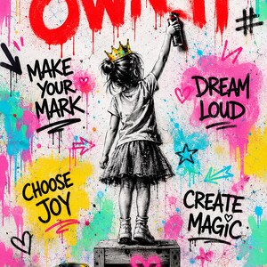 May include: A wall art print featuring a child wearing a crown, standing on a wooden crate, spray painting the text OWN IT. The background is a vibrant graffiti mural with splashes of pink, yellow, and blue, including the phrases MAKE YOUR MARK, DREAM LOUD, CHOOSE JOY, and CREATE MAGIC.