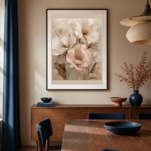 May include: A framed wall art print featuring a soft-toned botanical illustration of three large, layered flowers in shades of cream, beige, and pale pink, set against a muted, textured background with delicate brown foliage accents.