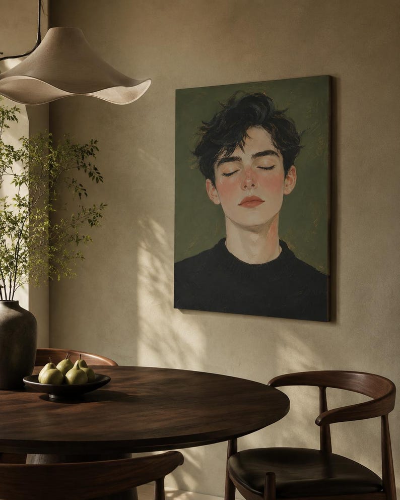 May include: A rectangular wall art print featuring a digital painting of a person with dark, messy hair and closed eyes, wearing a black sweater against a muted olive green background. The portrait captures a serene expression with soft pink cheeks.