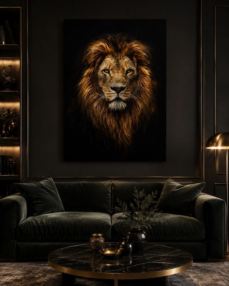 May include: A large rectangular wall art print featuring a detailed portrait of a lion with a thick, golden-brown mane against a solid black background. The lion is depicted facing forward with amber eyes, set in a dark, moody interior space.
