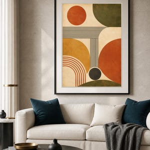 Puede incluir: Una impresi&oacute;n de arte mural enmarcada que presenta una composici&oacute;n geom&eacute;trica abstracta sobre un fondo crema. El dise&ntilde;o incluye un c&iacute;rculo naranja quemado, un semic&iacute;rculo verde oscuro, un semic&iacute;rculo amarillo mostaza y un gran semic&iacute;rculo rojo terracota.