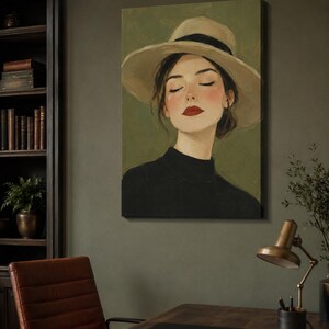 May include: A rectangular canvas wall art print featuring an oil painting of a person with closed eyes, wearing a wide-brimmed beige hat with a black band and a black high-neck top, set against a solid olive green background with visible brushstrokes.