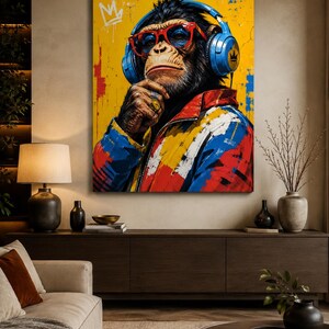 May include: A vertical wall art print featuring a chimpanzee wearing bright red-rimmed glasses and blue over-ear headphones. The chimpanzee wears a colorful jacket with red, blue, and white patterns against a vibrant yellow background with graffiti.