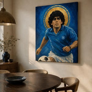 May include: A rectangular oil painting on canvas depicting a soccer player with dark curly hair wearing a blue jersey with a white N logo and white shorts. A large gold circular halo is painted behind the head against a deep blue background.