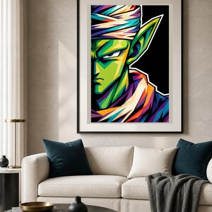 May include: A framed wall art print featuring a stylized, colorful portrait of a green-skinned character with pointed ears, wearing a white turban and a purple garment, set against a stark black background with bold, angular lines and vibrant shading.