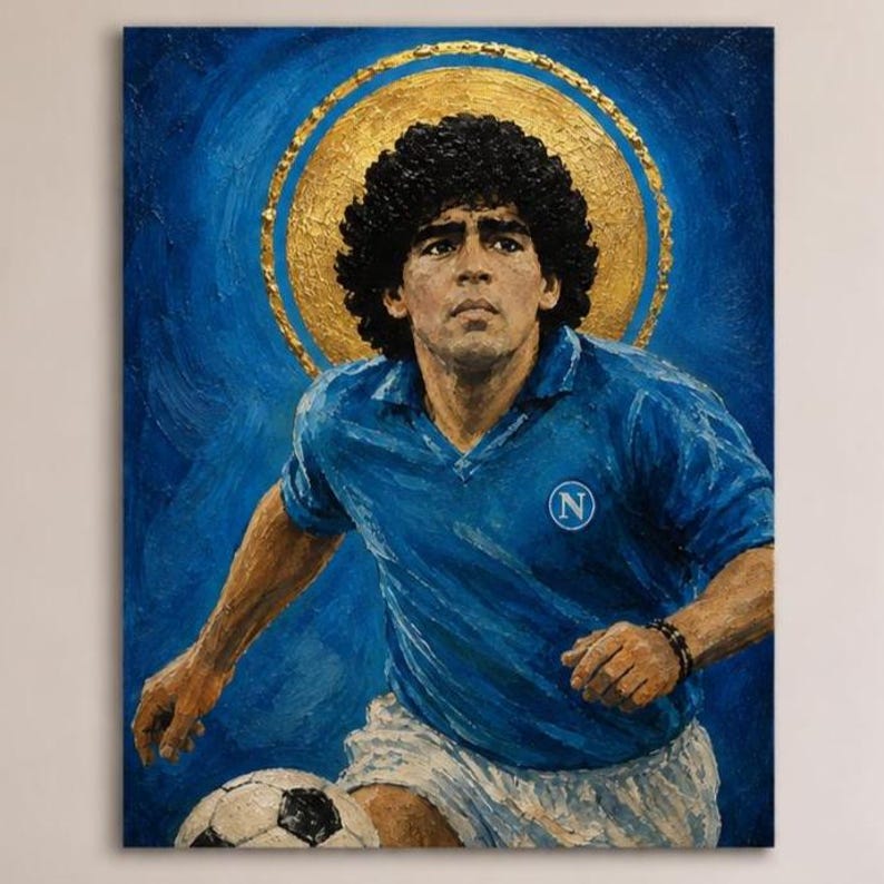 May include: An oil painting on canvas depicting a soccer player with curly dark hair wearing a blue jersey with a white N logo. The player is positioned in front of a large gold circular halo against a textured deep blue background with a soccer ball.