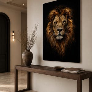 May include: A rectangular wall art print featuring a detailed portrait of a lion with a thick, golden-brown mane against a solid black background. The lion is shown from the front, looking directly forward with amber eyes and a focused expression.