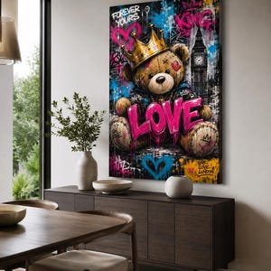 May include: A vertical wall art print featuring a brown teddy bear wearing a gold crown, centered against a dark background with graffiti-style text including "FOREVER YOURS," "KING," "LOVE," and "LIVE LOVE LONDON," alongside a depiction of Big Ben.