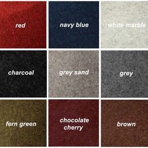 Op de afbeelding: Negen stofstalen in verschillende kleuren en texturen, waaronder rood, marineblauw, wit marmer, antraciet, grijs zand, grijs, varengroen, chocoladekers en bruin.