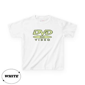 May include: A white short-sleeved t-shirt featuring a light green graphic on the chest. The graphic displays the text DVD VIDEO with the letters DVD positioned above a stylized disc icon. A small red script logo is printed near the neckline.