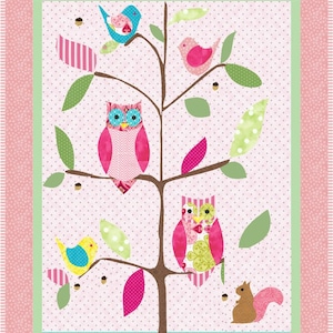 May include: A pink and green patchwork quilt featuring a tree, owls, birds, and a squirrel. The tree has a brown trunk and pink, green, and white leaves. The owls are pink and white with black eyes. The birds are blue, yellow, and pink. The squirrel is brown.