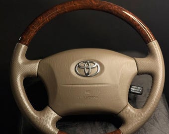 Volante Toyota de cuero con vetas de madera / Mejora del interior perforado de lujo en color beige
