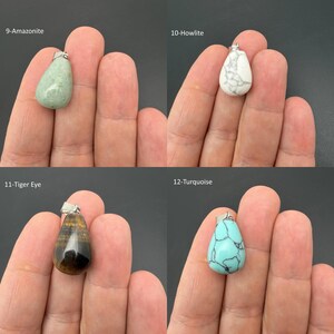 May include: Four teardrop-shaped gemstone pendants with silver-toned bails. The collection includes a smooth light green Amazonite, a white Howlite with grey veining, a brown and gold striped Tiger Eye, and a bright blue Turquoise with black veining.