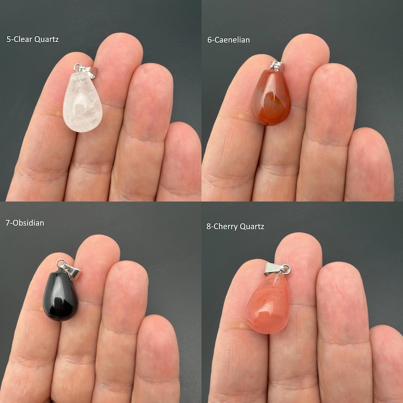 May include: Four teardrop-shaped gemstone pendants with silver-toned bails. The collection includes 5-Clear Quartz, 6-Caenelian, 7-Obsidian, and 8-Cherry Quartz. Each polished stone features a smooth, rounded surface and a distinct color profile.