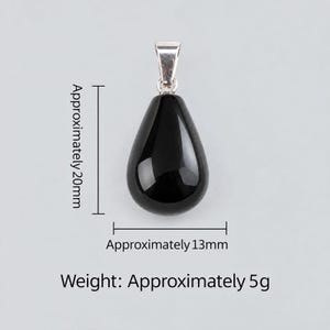 May include: A smooth, black, teardrop-shaped pendant with a silver-toned metal bail. The pendant measures approximately 20mm in height and 13mm in width, with a total weight of approximately 5g as indicated by the text in the image.