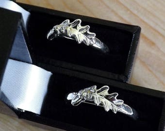 His and her oak leaf and acorn rings. Hand forged in Cornwall from sterling silver sheet and wire. Beautiful rings to symbolise partnership.