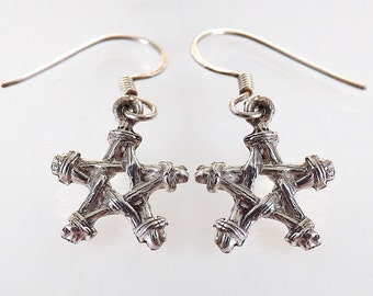 Handcrafted Wiccan pentagram earrings in fine silver (99% pure silver) on sterling silver ear wires. Made in Cornwall, UK