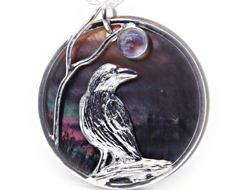 Raven pendant with an AA grade rainbow moonstone on an 18" Sterling Chain. Custom made.  Workmanship guaranteed for life.