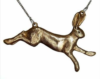 Bronze Running Hare Pendant with a Cubic Zirconia Eye