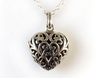 Sterling silver heart shaped locket on 16" trace chain
