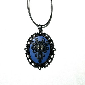 Haunted Mansion Cameo Necklace Glowing Eyes Creepy Wallpaper