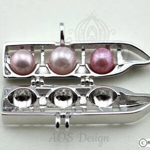 Trending Now: Resort Monorail Pearl Cage Necklace - EPCOT & Grand Floridian Holds 3 Pearls