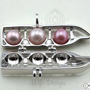 Trending Now: Resort Monorail Pearl Cage Necklace - EPCOT & Grand Floridian Holds 3 Pearls