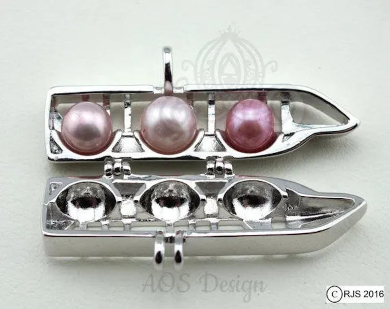 Trending Now: Resort Monorail Pearl Cage Necklace - EPCOT & Grand Floridian Holds 3 Pearls