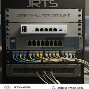 May include: A black server rack frame featuring the text JRTS at the top, a silver panel labeled JRTECHSUPPORT.NET, a white network router with five ports, a grey eight-port network switch, and a cable management brush panel with connected cables.