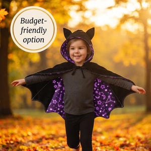 May include: A black bat costume featuring a hooded cape with scalloped edges and a purple interior lining decorated with white celestial patterns including stars, moons, and constellations. The text reads LAST-MINUTE BAT COSTUME and Budget-friendly option.
