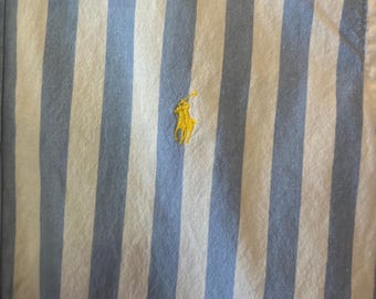 Blue and white stripe ruffled collar pony shirt