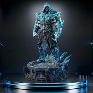 May include: A detailed figurine of a warrior clad in blue and black armour with crystalline ice-like protrusions on the shoulders, arms, and legs. The figure wears a hooded mask and stands on a circular, textured base featuring jagged ice elements.
