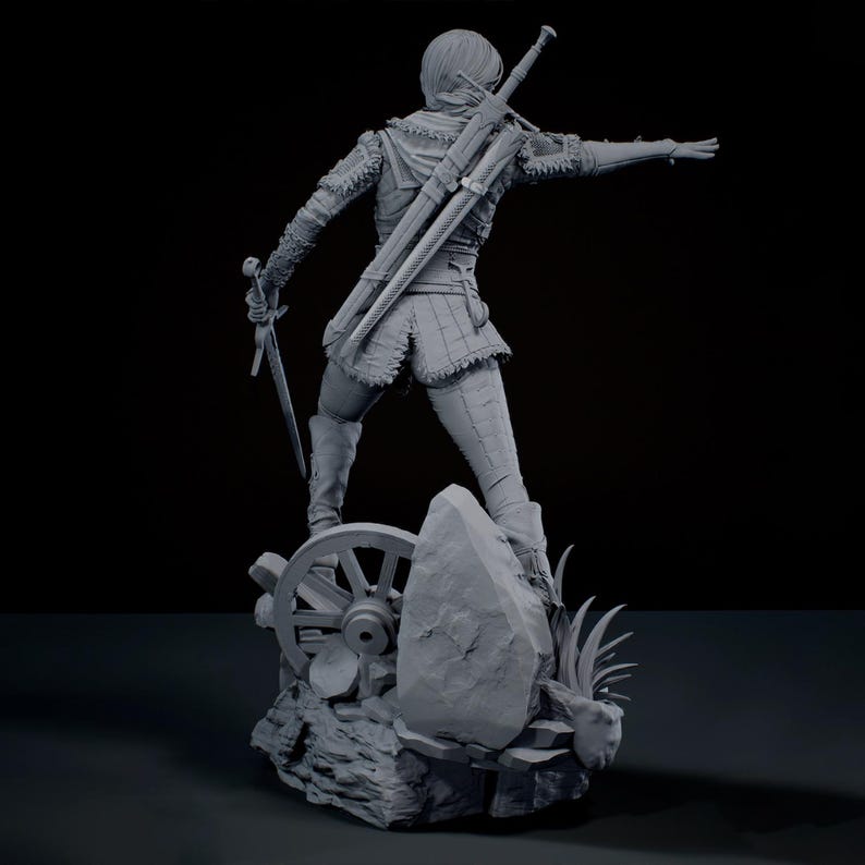 May include: A grey monochromatic figurine of a warrior standing on a rocky base with a wagon wheel. The figure wears textured armour, carries a sword in one hand, and has a second sword sheathed on their back, with one arm extended outwards.
