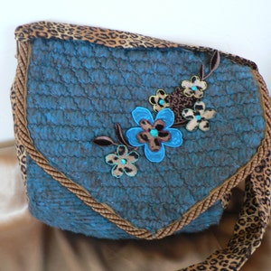 Small Pouch style Purse applique in an Leopard print with turquoise approx 8.5X10 with shoulder handle approx  40&quot;  long