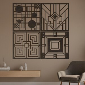May include: Four square dark brown wall panels featuring intricate geometric cutouts. The top left panel displays circles and grid lines, the top right shows angular lines, the bottom left has a Greek key pattern, and the bottom right features nested squares.