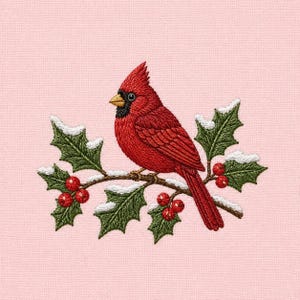 May include: An embroidery design on a light pink fabric featuring a bright red cardinal bird perched on a holly branch. The branch has dark green leaves with white snow accents and clusters of small red berries surrounding the bird.