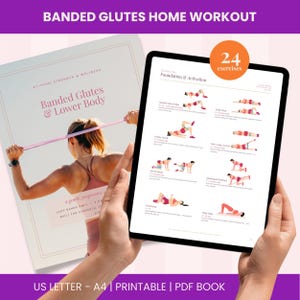 May include: A digital tablet displaying a workout guide titled Foundation & Activation with 24 exercises, held in front of a printed manual titled Banded Glutes & Lower Body, featuring illustrations of various glute exercises using resistance bands.