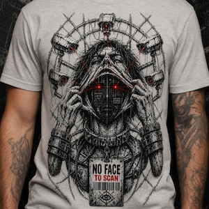 May include: A light grey t-shirt featuring a detailed black and white graphic of a figure pulling back a mask to reveal a digital face. The design includes red-eyed security cameras, a barbed wire circle, and a tag reading NO FACE TO SCAN.