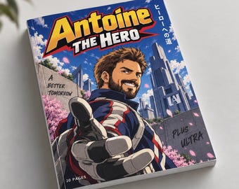 May include: A softcover book titled Antoine The Hero with a blue sky background, a bearded character reaching forward, and a futuristic city. The cover features the text A Better Tomorrow, Plus Ultra, and 20 Pages in a manga-inspired art style.