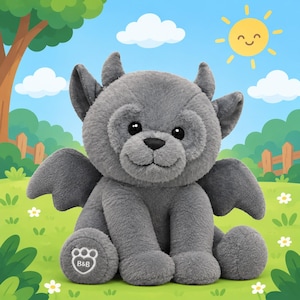 May include: A plush toy shaped like a grey gargoyle with small wings, pointed ears, and black eyes. The creature has a soft, fuzzy texture and a stitched paw pad on its left foot featuring the letters B&B inside a white paw print outline.