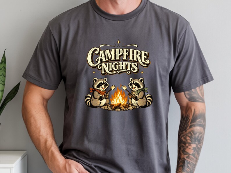 Retro illustration of two raccoons wearing bandanas roasting marshmallows over a campfire with the text Campfire Nights above them on a cream background. — product photo 11
