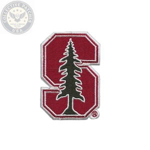 May include: An embroidered patch featuring a block letter S in deep red with a white border. A dark green silhouette of a coniferous tree is centered within the letter. A small registered trademark symbol is visible in the bottom right corner.