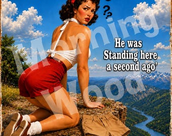 May include: A rectangular metal sign featuring a pin-up style illustration of a person kneeling on a cliff edge. The text reads Morning WooD and He was Standing here a second ago. The person wears a white halter top, red shorts, and brown shoes.