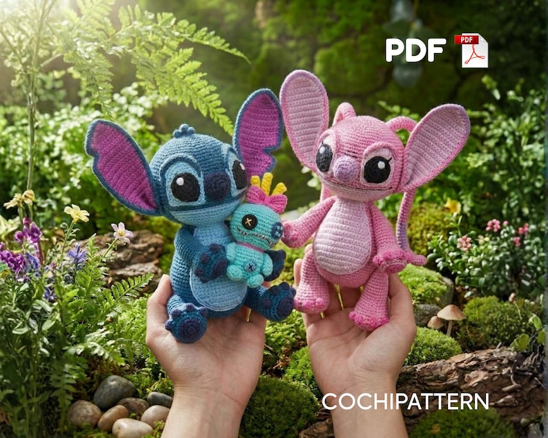 May include: Two crocheted figures, one blue with large ears holding a small turquoise doll and one pink with large ears, both featuring black eyes and stitched details. The image includes a PDF icon and the text COCHIPATTERN at the bottom.