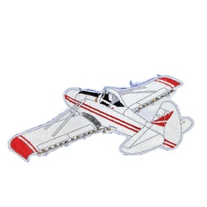 May include: An embroidered patch featuring a white single-engine airplane with red stripes along the fuselage and wings. The aircraft is depicted in a side profile view with visible wing struts, a propeller, and a tail section with red accents.
