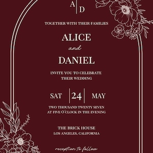 May include: A deep burgundy wedding invitation card featuring a white arched border and floral line art in the corners. The text reads: A|D, TOGETHER WITH THEIR FAMILIES, ALICE and DANIEL, INVITE YOU TO CELEBRATE THEIR WEDDING, SAT 24 MAY, TWO THOUSAND TWENTY SEVEN, AT FIVE O'CLOCK IN THE EVENING, THE BRICK HOUSE, LOS ANGELES, CALIFORNIA, reception to follow.