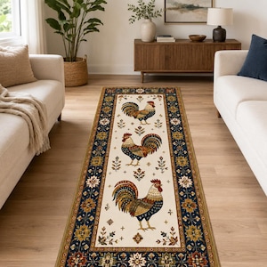 May include: A rectangular runner rug featuring a cream-colored center panel decorated with three roosters in shades of red, blue, and gold. The rug is framed by a wide, dark blue border with intricate floral and geometric patterns in gold and brown.