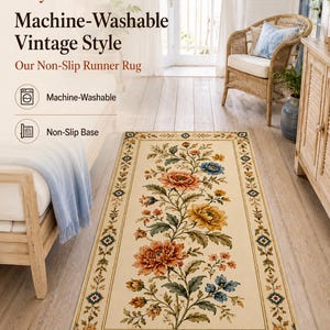 May include: A rectangular runner rug with a cream background featuring a central floral pattern of orange, yellow, and blue flowers with green leaves. The rug has a decorative border with small floral motifs and a non-slip base, machine-washable.