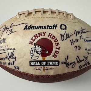 May include: A white leather football with signatures from Kenny Houston and other Hall of Famers. The football is from the Kenny Houston Hall of Fame Golf Classic, sponsored by Continental Airlines and held at the WindRose Golf Club on October 10, 2003.