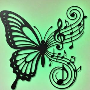 May include: A black metal wall art piece shaped like a butterfly with one wing transitioning into musical notes and staff lines. The design is backlit with a soft green glow, creating a silhouette effect against the light-colored wall surface.